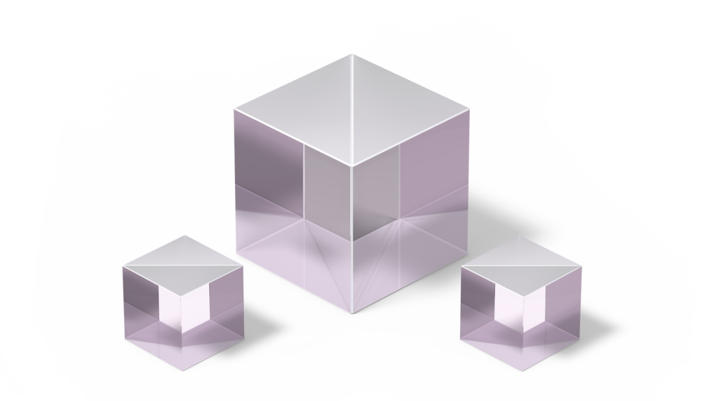 Three non-polarizing beamsplitter cubes in transparent pink color